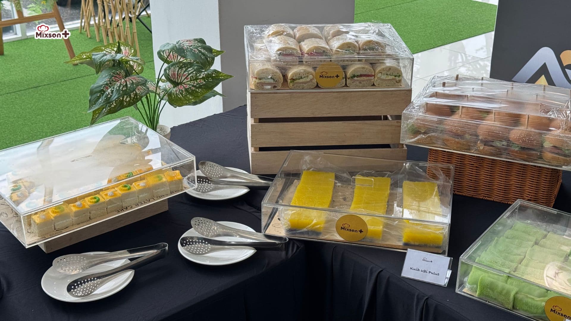 Tea break spread with sandwiches and kuih at a corporate event