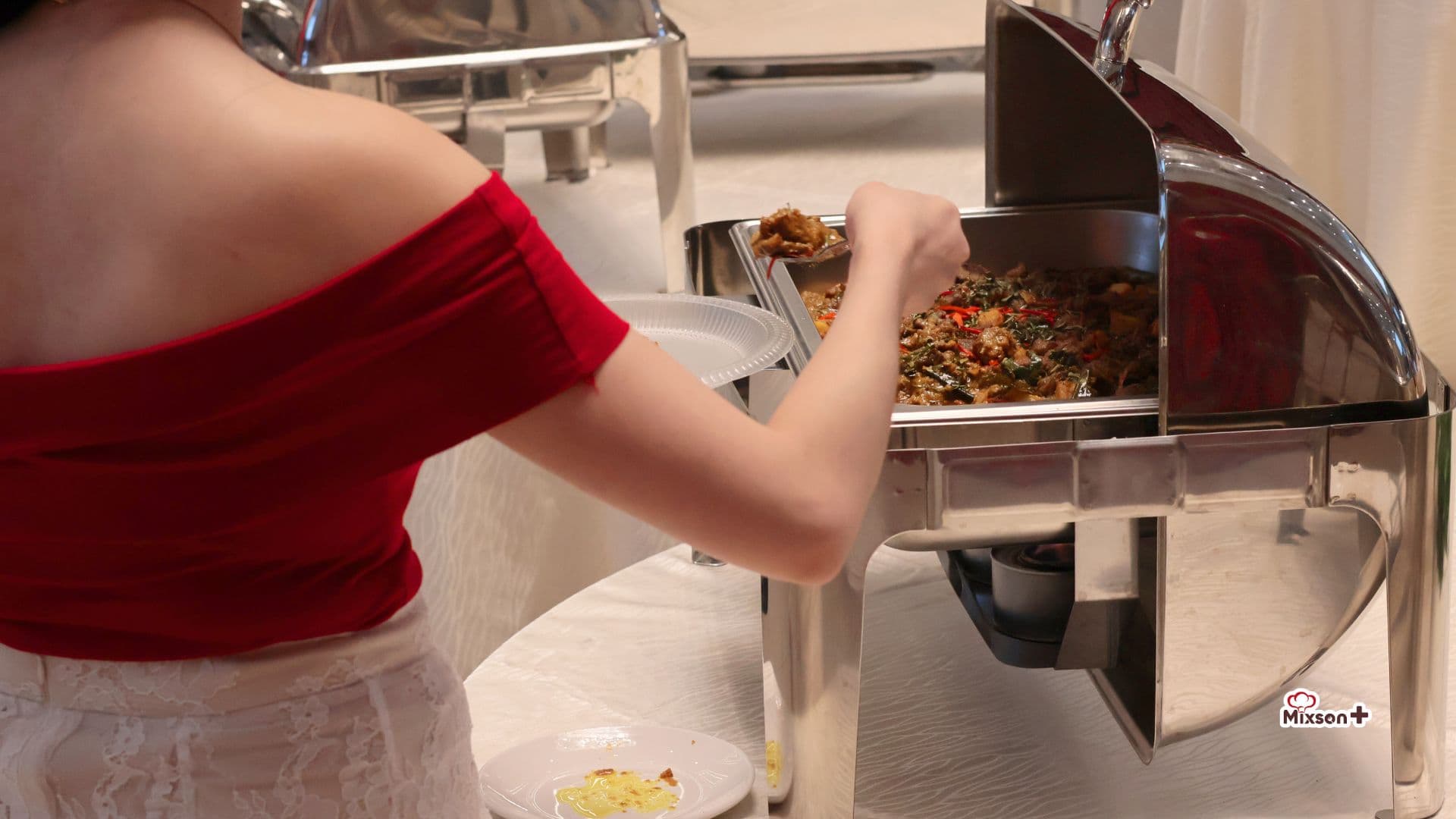 Guest serving herself from the buffet line