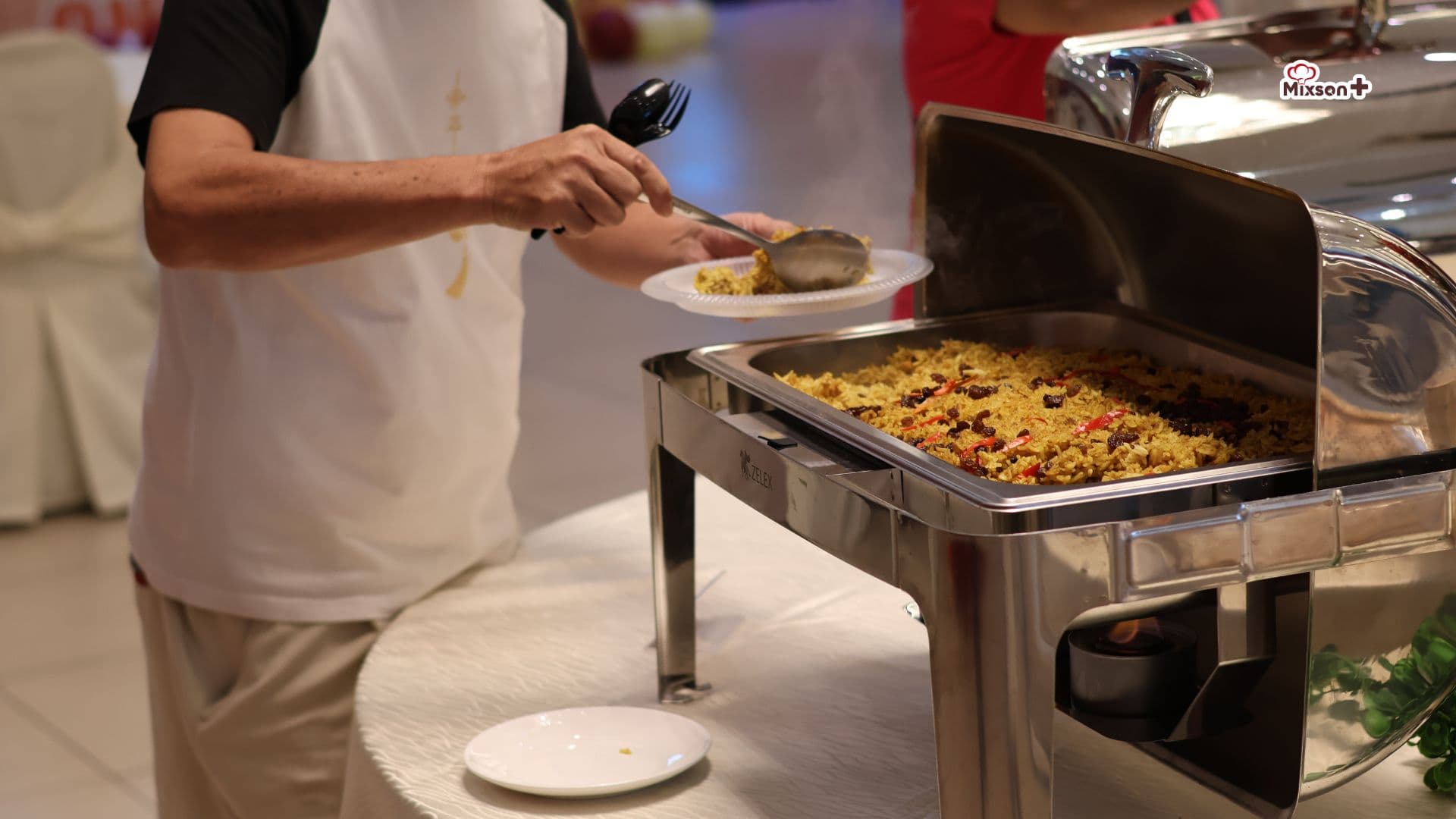 Our crew serving nasi from the chafing dish