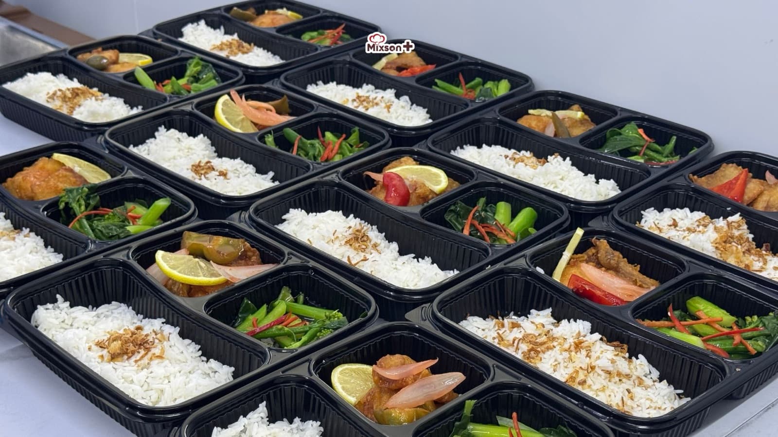 Bento meal boxes prepared in bulk at the Mixson Plus central kitchen
